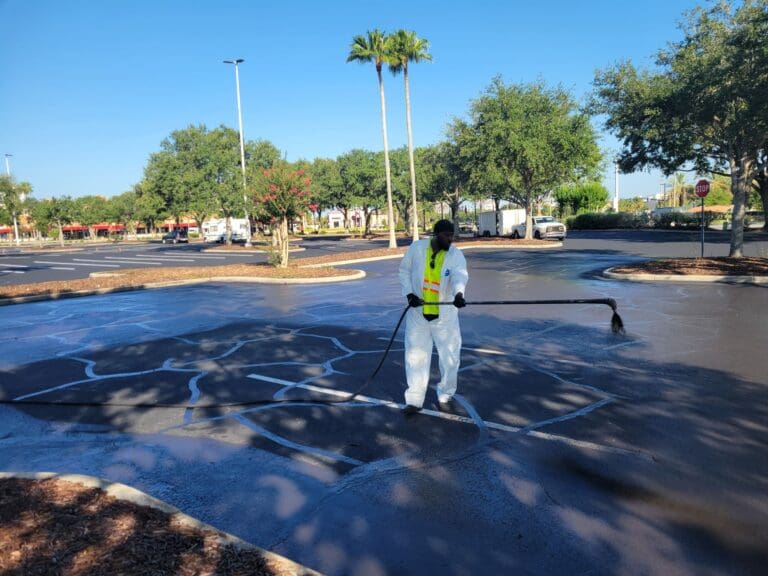 Landmark Employee cleaning paved lot