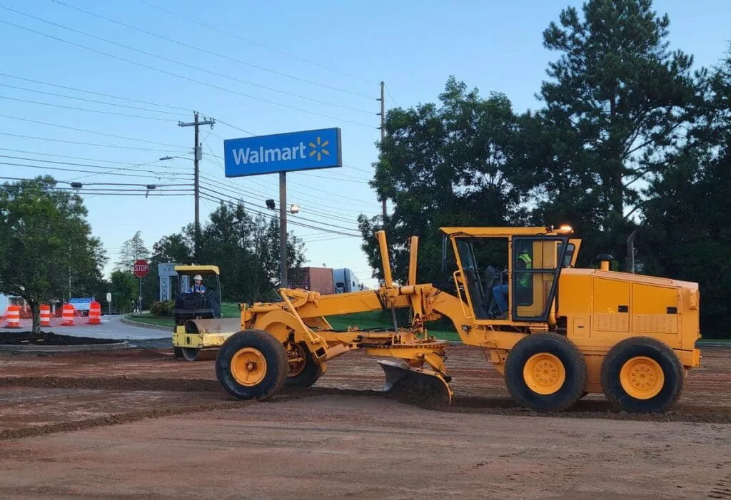 Smoothing out Walmart Parking lot before laying asphalt