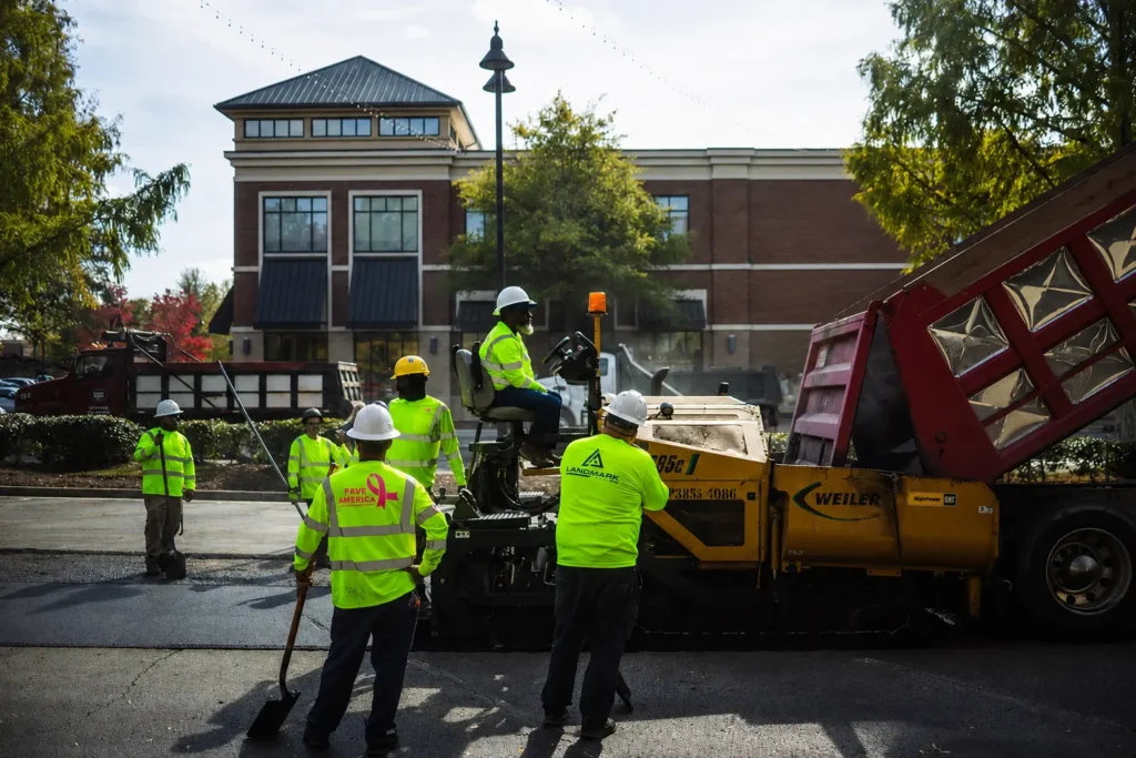 Landmark Paving crew installing asphalt in a commercial parking lot