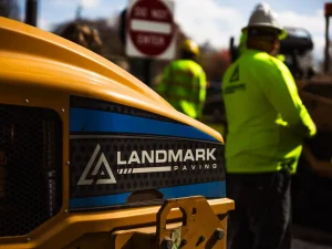Landmark Paving equipment and crew preparing for a commercial paving project