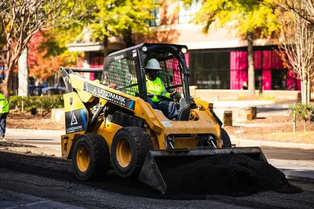 Landmark Paving asphalt paving equipment in Jacksonville, FL performing commercial pavement installation